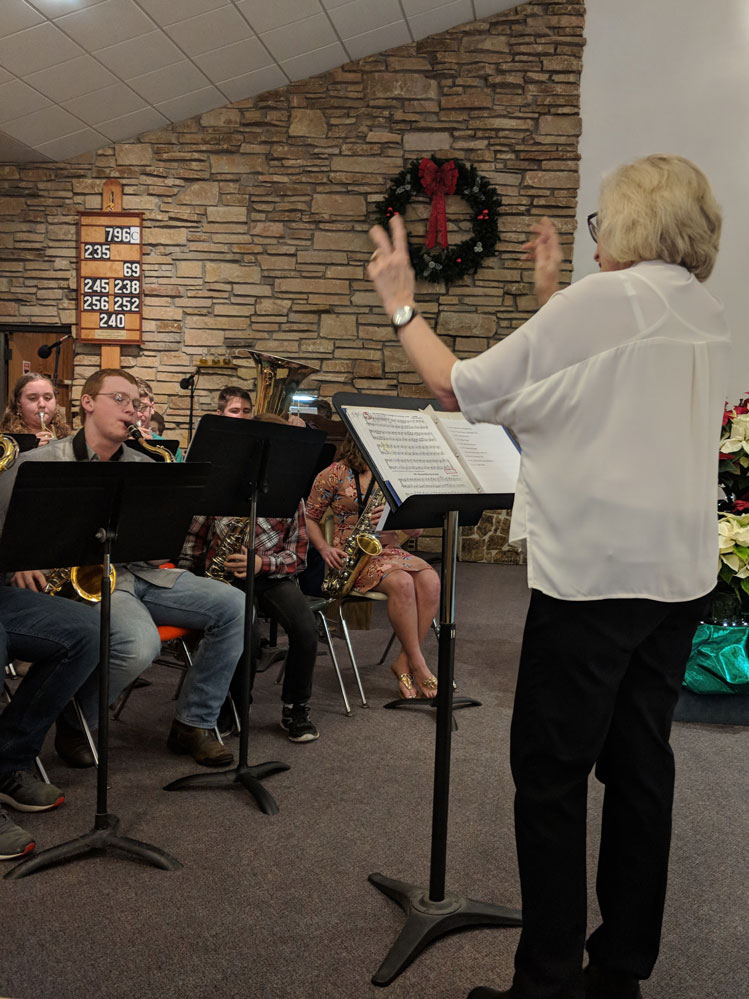 Laurie directs the band at Good Shepherd's Christmas Eve Mass